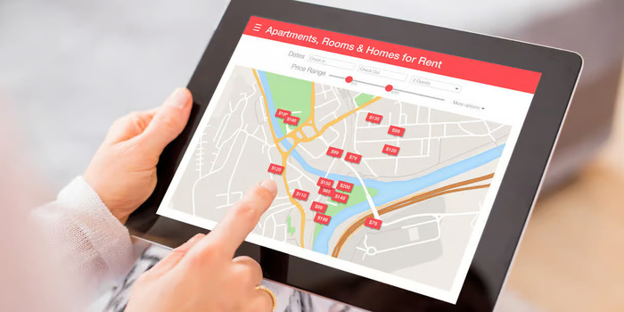 Landlord Swiping Over a Screen To Find Great Tenants