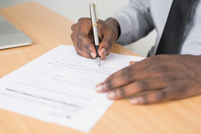 Someone processing a paper rental application